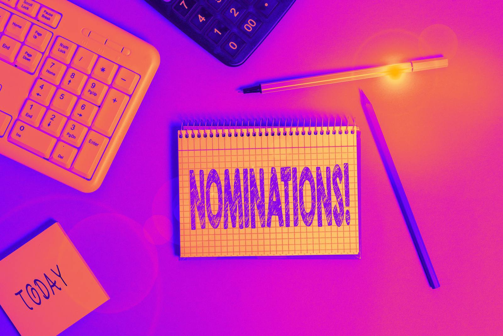 A colourful notebook open to the word nomination